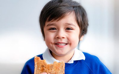 Wraparound childcare  - Child eating toast